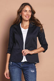 Model Madeline wearing size 10 of The Everyday Blazer in colour DarkNavy (Blue), from the front, cropped image