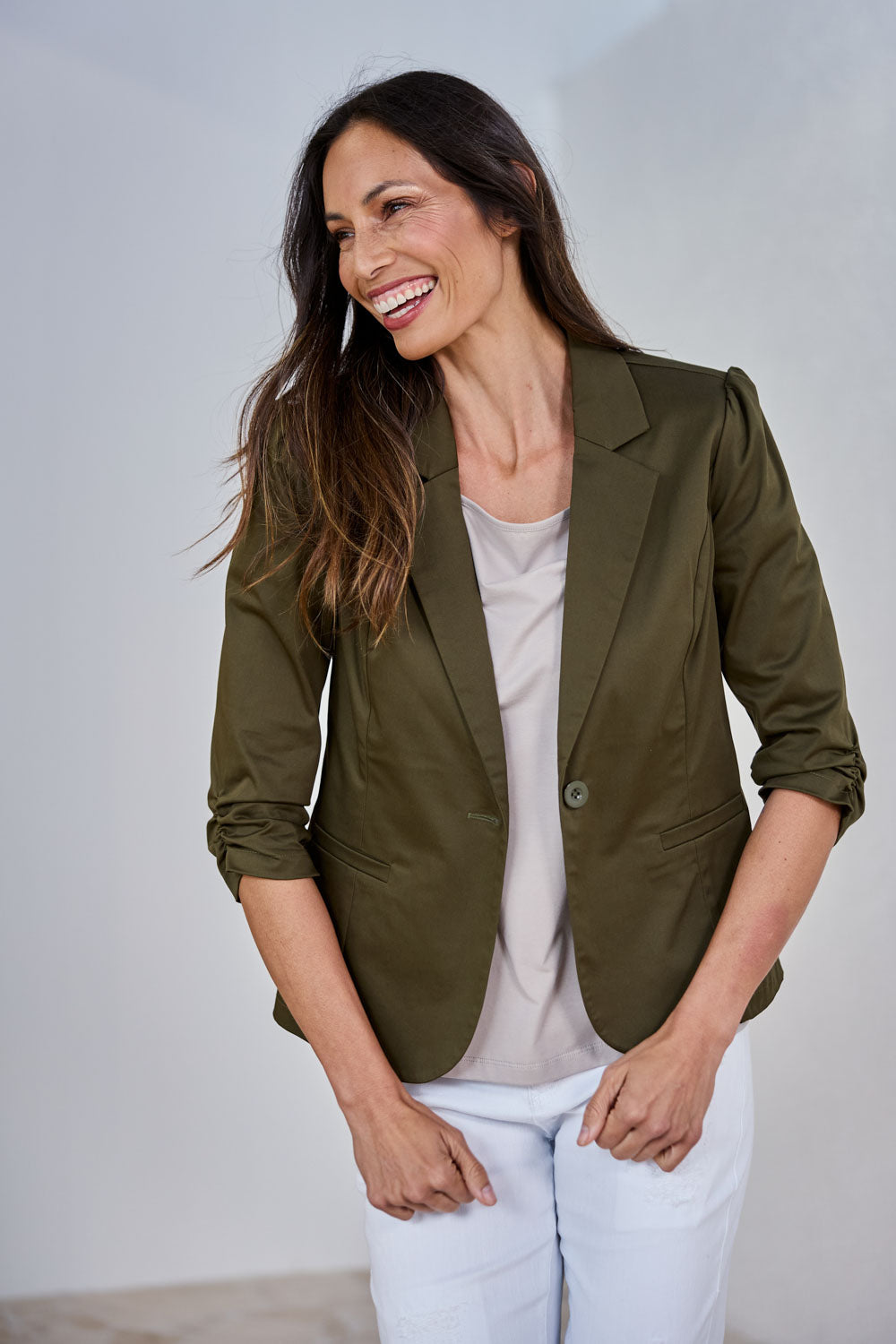 Model Amanda wearing size 10 of The Everyday Blazer in colour Darkolive (Green), from the front, showing the whole outfit
