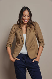 Model Amanda wearing size 10 of The Everyday Blazer in colour Donut, from the front, cropped image