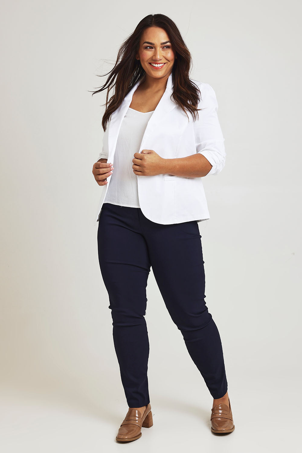 Model Ashleigh wearing size 16 of The Everyday Blazer in colour White (White), from the front, showing the whole outfit