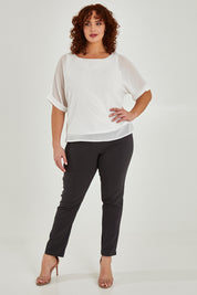 Model Maddy wearing size 16 of The Slim Cut Stretch Pant in colour Charcoal (Grey), from the front, showing the whole outfit