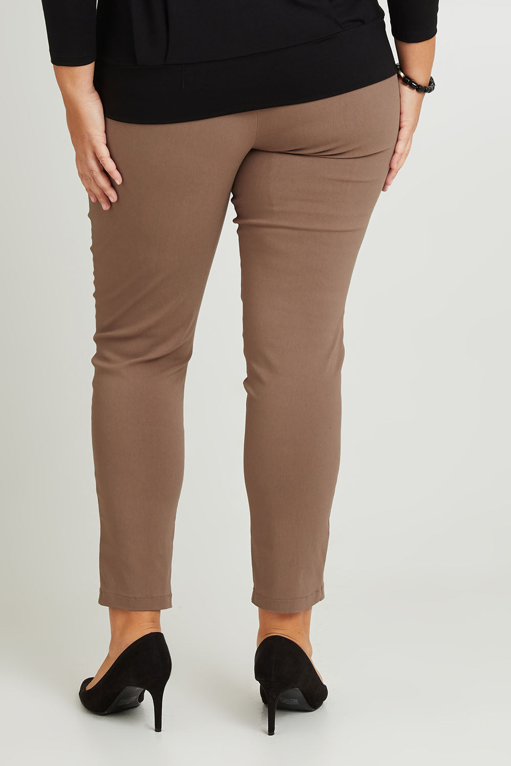 Model Fiona wearing size 16 of The Slim Cut Stretch Pant in colour Hurricane, from the back
