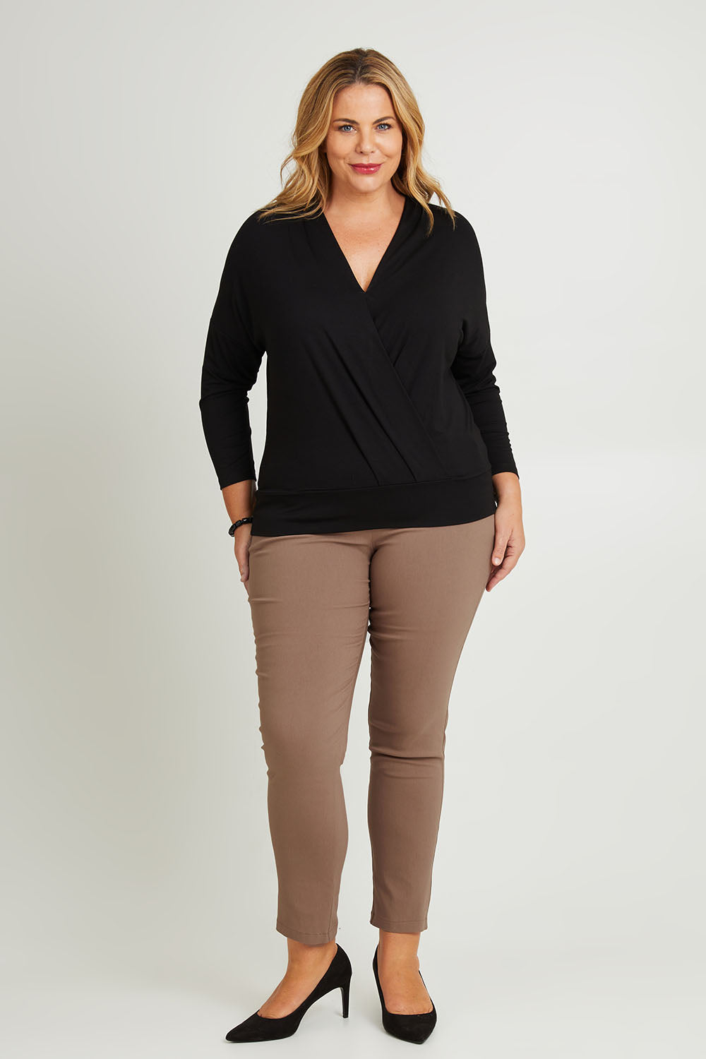 Model Fiona wearing size 16 of The Slim Cut Stretch Pant in colour Hurricane, from the front, showing the whole outfit