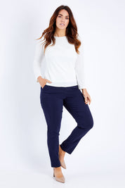 Model Laura wearing size 12 of The Slim Cut Stretch Pant in colour Navy (Blue), from the front, showing the whole outfit