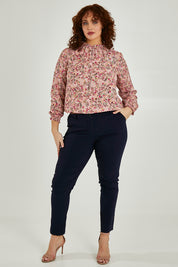 Model Maddy wearing size 16 of The Slim Cut Stretch Pant in colour Navy (Blue), from the front, showing the whole outfit