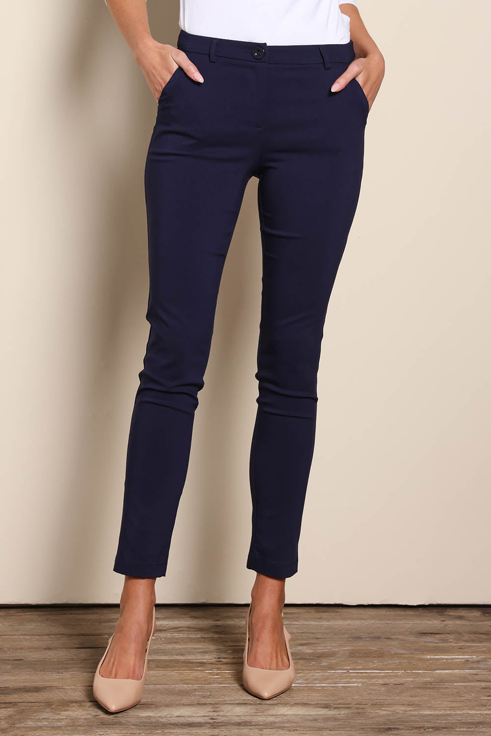 Model Madelinec wearing size 10 of the The Slim Cut Stretch Pant - Navy in colour Navy, from the front