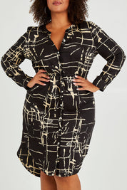 Model Alexis wearing size 16 of The Luxe Viscose Drawstring Dress in colour Sketch (Black), from the front, cropped image