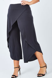Model Fiona wearing size 16 of The Cross Over Pant in colour Graphite (Grey), from the front, cropped image
