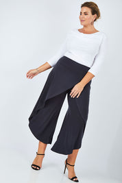 Model Fiona wearing size 16 of The Cross Over Pant in colour Graphite (Grey), from the front, showing the whole outfit