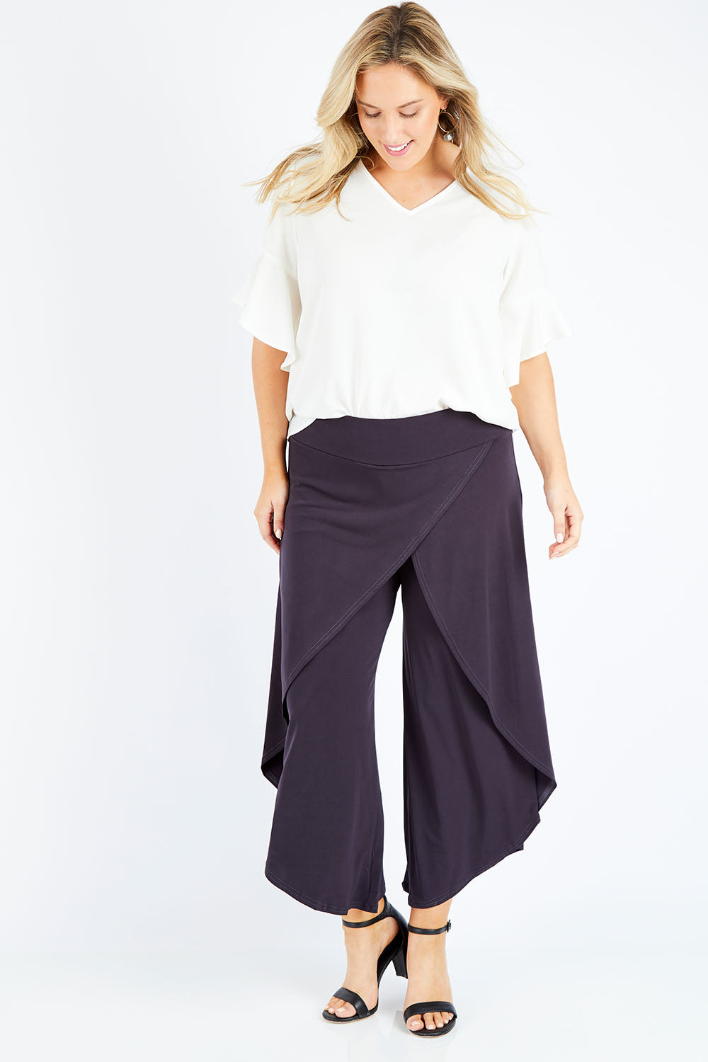 Model Jess wearing size 14 of The Cross Over Pant in colour Graphite (Grey), from the front, showing the whole outfit