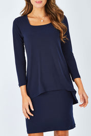 Model Madeline wearing size 10 of The Rita Dress in colour Navy (Blue), from the front, cropped image