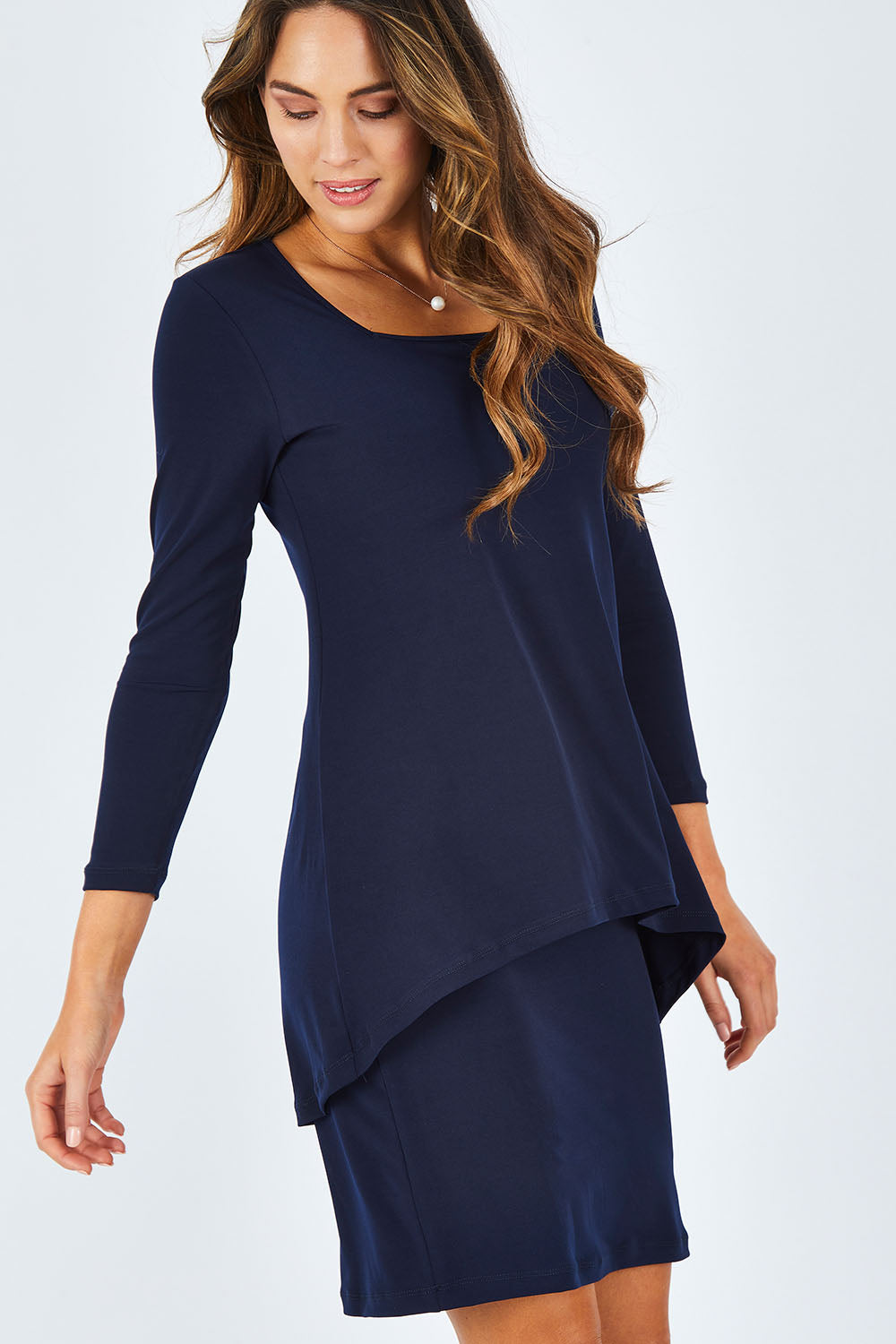 Model Madeline wearing size 10 of The Rita Dress in colour Navy (Blue), from the front, cropped image