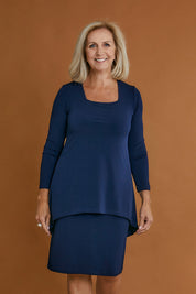 Model Sandy wearing size 10 of The Rita Dress in colour Navy (Blue), from the front, cropped image