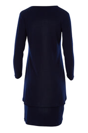 Product shot of The Rita Dress in colour Navy (Blue), from the back