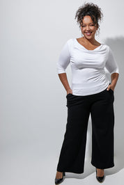 Model Alexis wearing size 16 of The Wide Leg Ponte Pant in colour Black (Black), from the front, showing the whole outfit