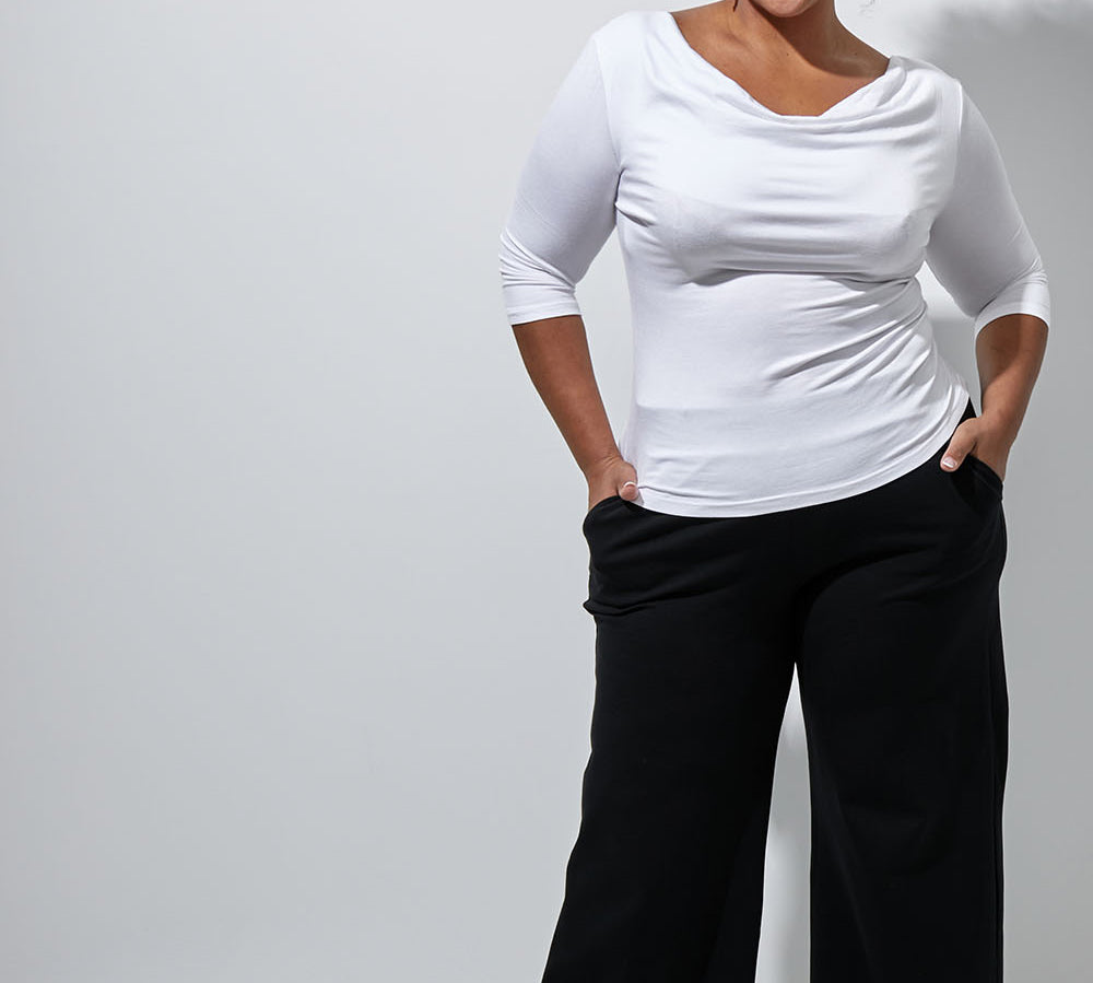 Model Alexis wearing size 16 of The Wide Leg Ponte Pant in colour Black (Black), from the front, showing the whole outfit