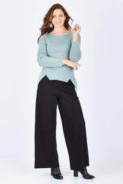 Model Lisa wearing size 10 of The Wide Leg Ponte Pant in colour Black (Black), from the front, showing the whole outfit
