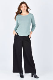 Model Lisa wearing size 10 of The Wide Leg Ponte Pant in colour Black (Black), from the front, showing the whole outfit