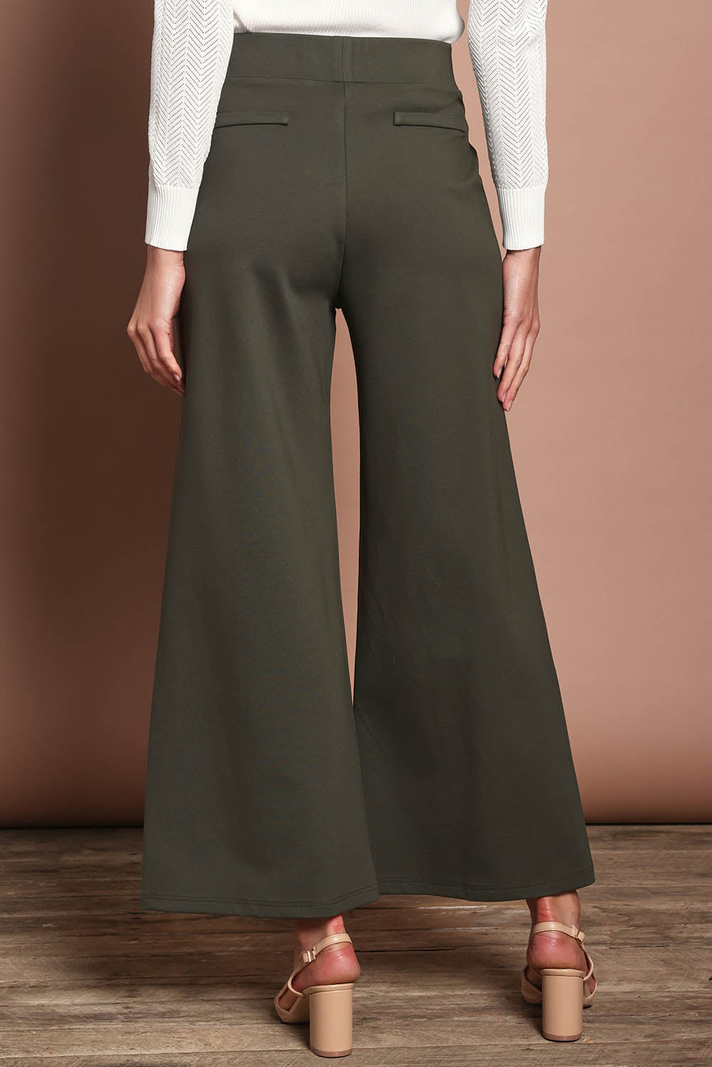 Model Amanda wearing size 10 of The Wide Leg Ponte Pant in colour Khakigreen (Green), from the back
