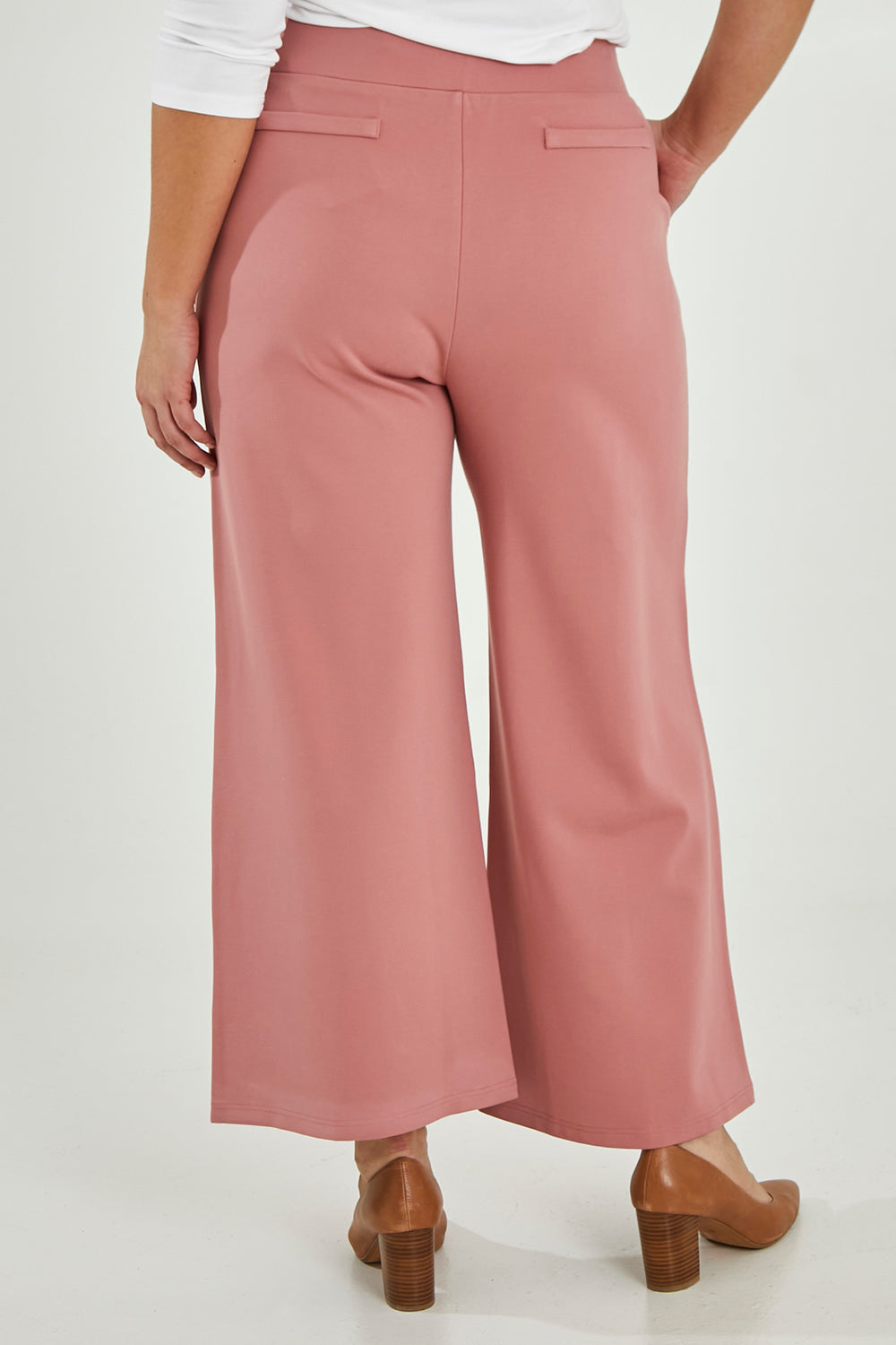 Model Maddy wearing size 16 of The Wide Leg Ponte Pant in colour Rose (Pink), from the back