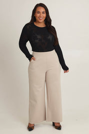 Model Ashleighf wearing size 16 of the The Wide Leg Ponte Pant - Sand in colour Sand, from the front