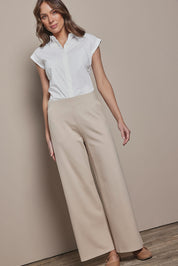 Model Madelinec wearing size 10 of the The Wide Leg Ponte Pant - Sand in colour Sand, from the front