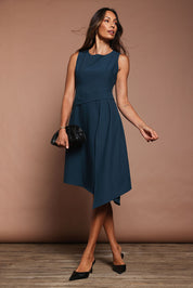 Model Amanda wearing size 10 of The Side Pleated Dress in colour Deepocean (Blue), from the front, showing the whole outfit