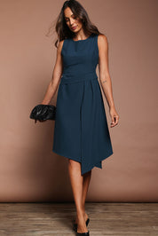 Model Amanda wearing size 10 of The Side Pleated Dress in colour Deepocean (Blue), from the front, showing the whole outfit