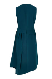 Product shot of The Side Pleated Dress in colour Deepocean (Blue), from the back