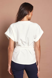 Model Madeline wearing size 10 of The Kimono Top in colour Ivory (White), from the back