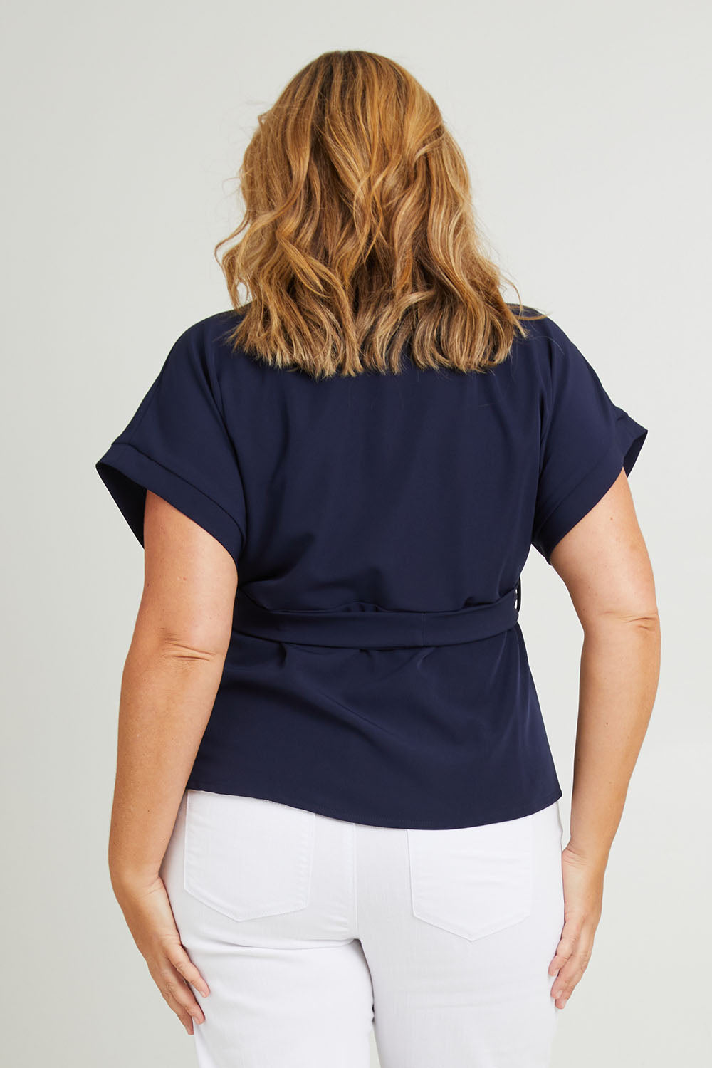 Model Fiona wearing size 16 of The Kimono Top in colour Navy (Blue), from the back