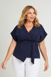 Model Fiona wearing size 16 of The Kimono Top in colour Navy (Blue), from the front, cropped image