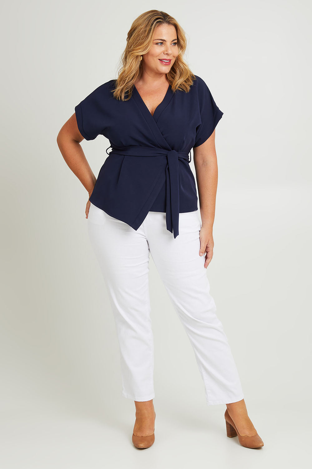 Model Fiona wearing size 16 of The Kimono Top in colour Navy (Blue), from the front, showing the whole outfit