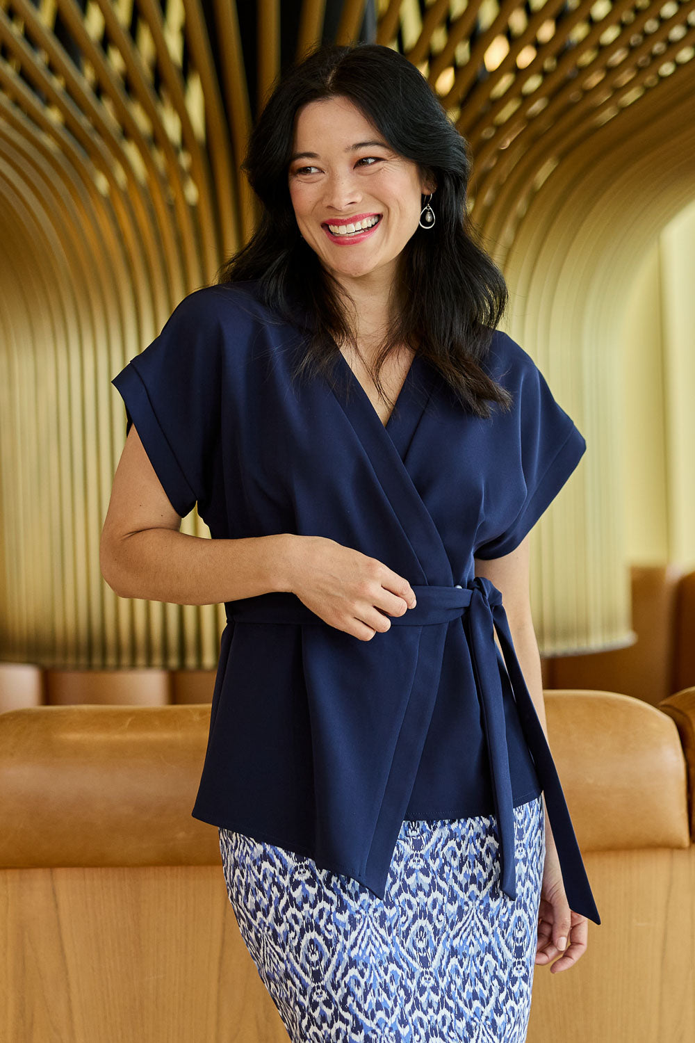 Model Miranda wearing size 10 of The Kimono Top in colour Navy (Blue), from the front, showing the whole outfit