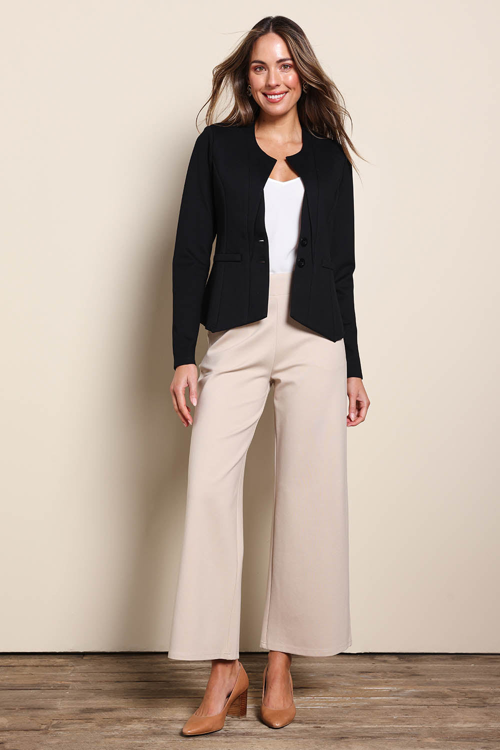 Model Madelinec wearing size 10 of the The Define Ponte Jacket - Black in colour Black, from the front