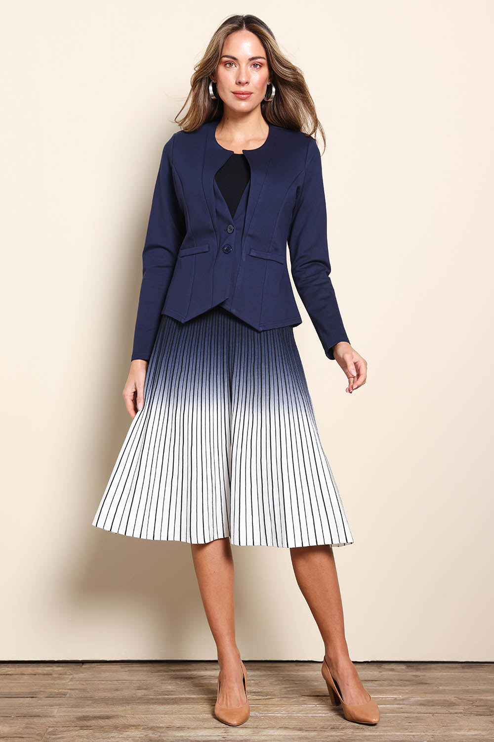 Model Madelinec wearing size 10 of the The Define Ponte Jacket - Darknavy in colour Darknavy, from the front
