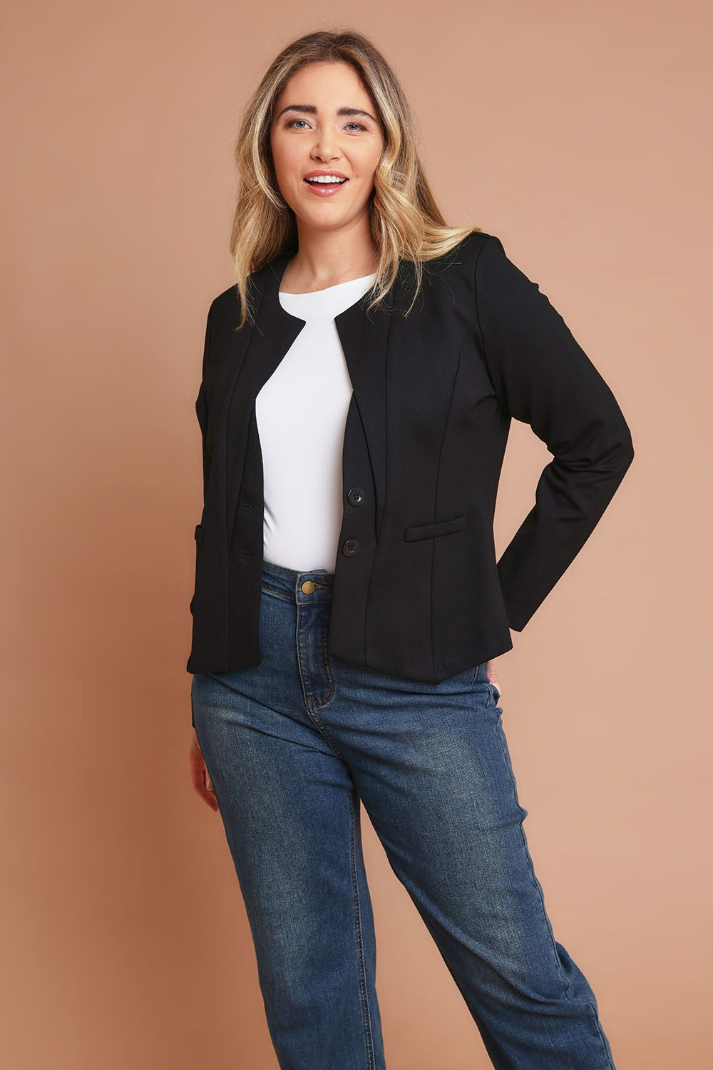 Model Chanel wearing size 16 of The Define Ponte Jacket in colour Jetblack (Black), from the front, showing the whole outfit
