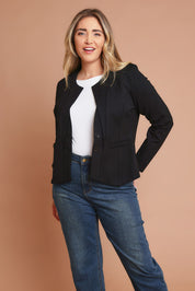 Model Chanel wearing size 16 of The Define Ponte Jacket in colour Jetblack (Black), from the front, showing the whole outfit