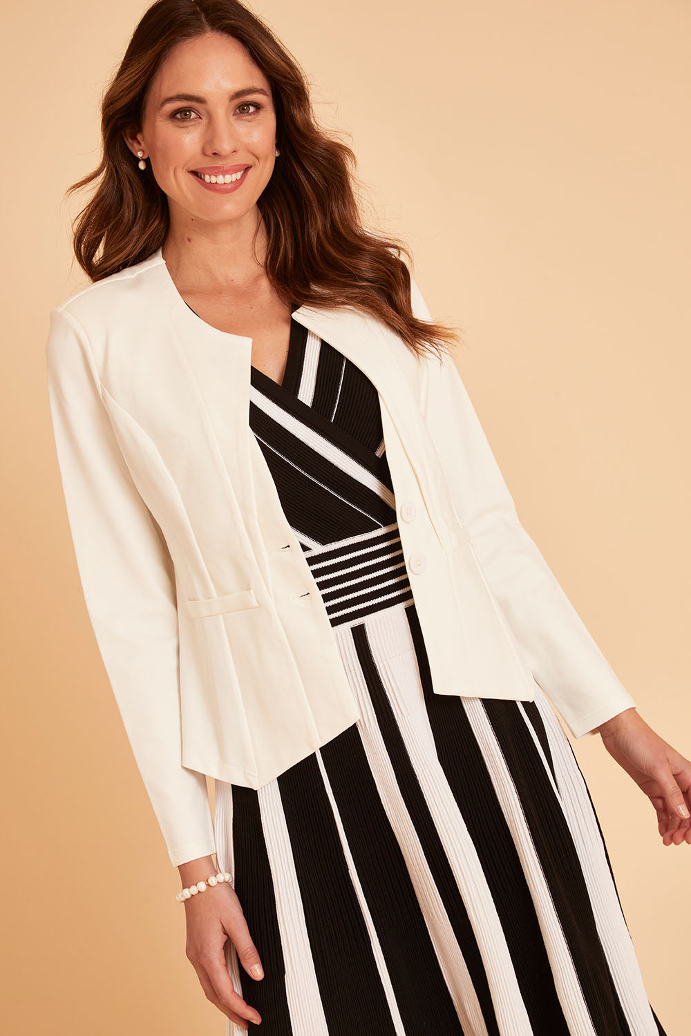 Model Madeline wearing size 10 of The Define Ponte Jacket in colour Pearl (White), from the front, cropped image