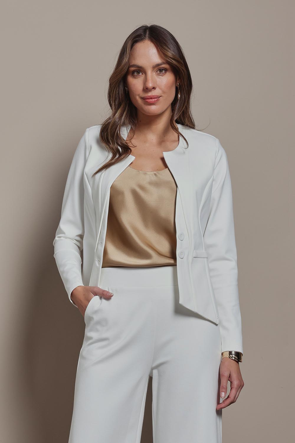 Model Madeline wearing size 10 of The Define Ponte Jacket in colour Pearl (White), from the front, showing the whole outfit