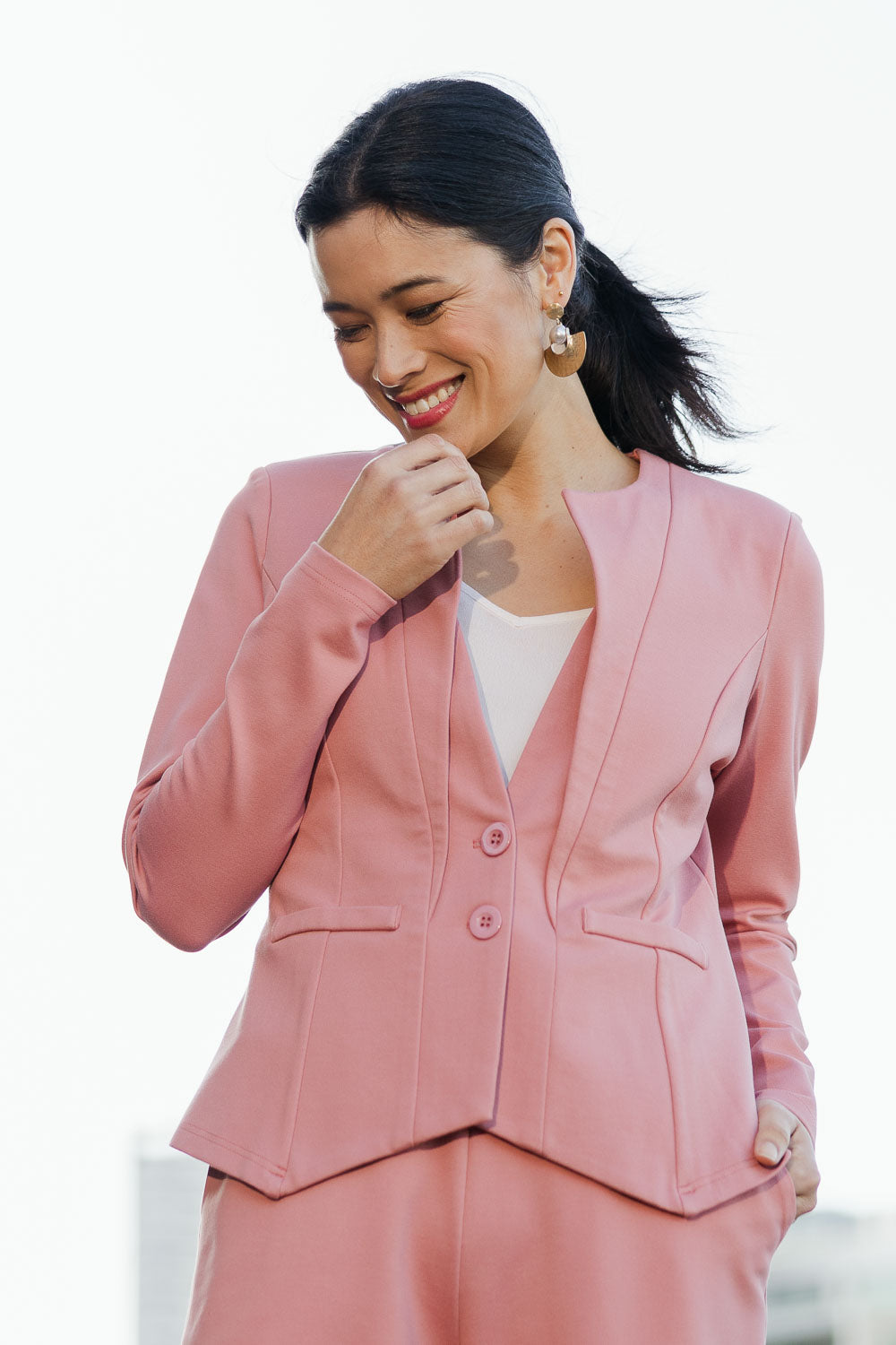 Model Miranda wearing size 10 of The Define Ponte Jacket in colour Rose (Pink), from the front, cropped image
