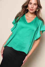 Model Madelinec wearing size 10 of the The Shirred Detail Top - Green in colour Green, in a cropped view