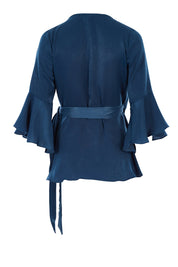 Product shot of The Luxe Wrap Top in colour Opal (Blue), from the back