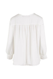 Product shot of The Luxe Dobby Blouse in colour White (White), from the back