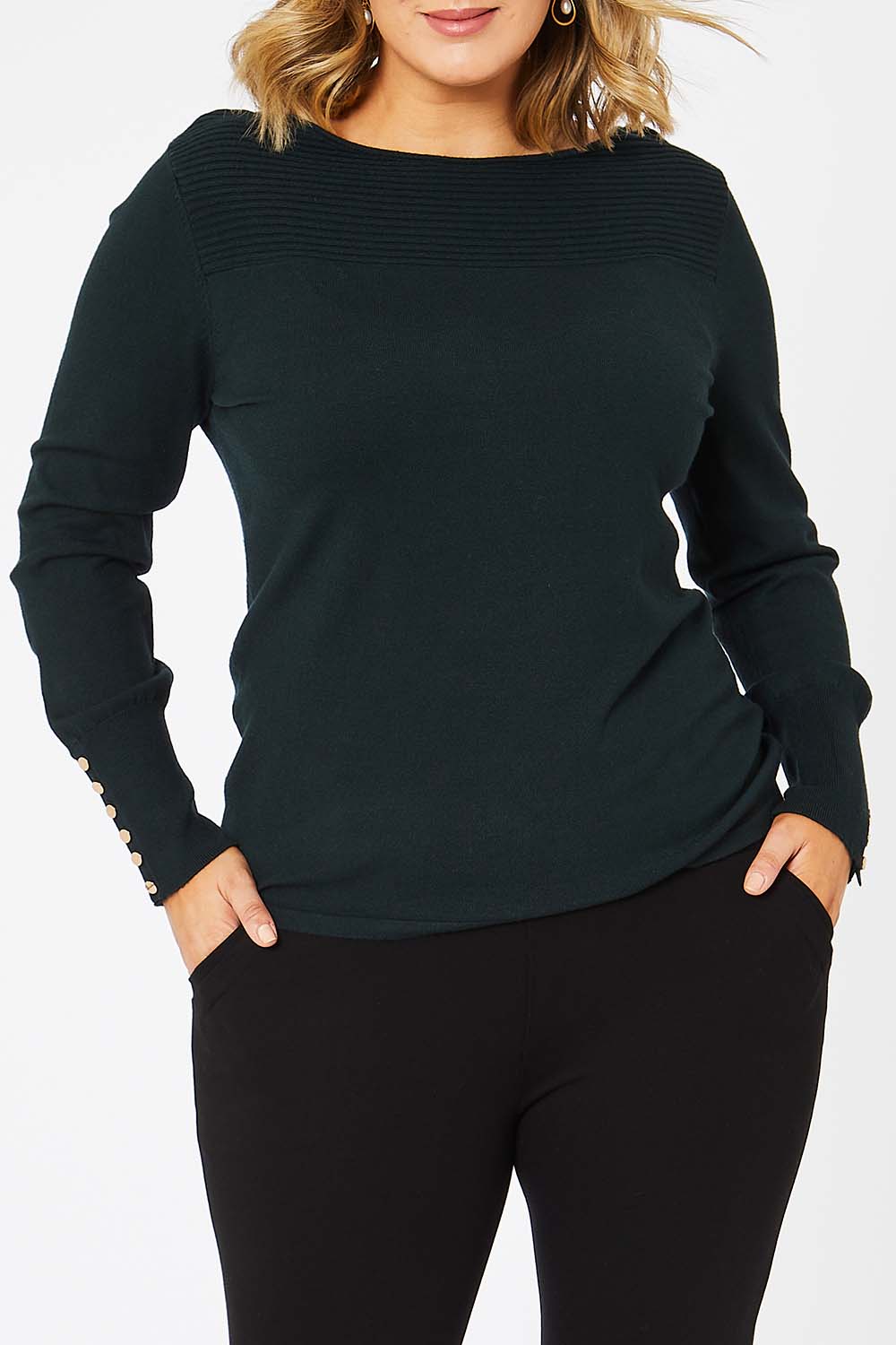 Model Jess wearing size L of The Boat Neck Knit in colour Darkpine (Green), from the front, cropped image