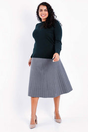Model Sasha-Lee wearing size XL of The Boat Neck Knit in colour Darkpine (Green), from the front, showing the whole outfit