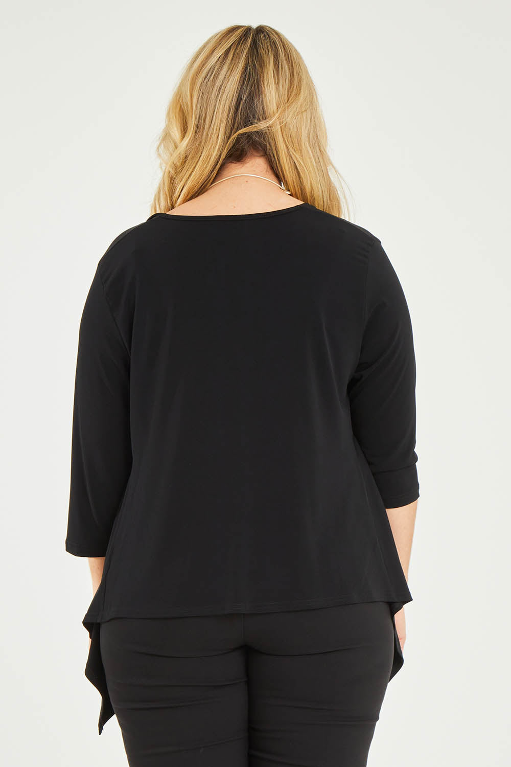 Model Katie wearing size 16 of The Drape Cardi in colour Black (Black), from the back