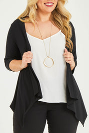 Model Katie wearing size 16 of The Drape Cardi in colour Black (Black), from the front, cropped image