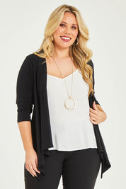 Model Katie wearing size 16 of The Drape Cardi in colour Black (Black), from the front, cropped image