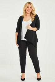 Model Katie wearing size 16 of The Drape Cardi in colour Black (Black), from the front, showing the whole outfit